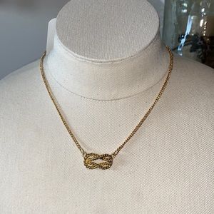 Gold tone rope knot necklace